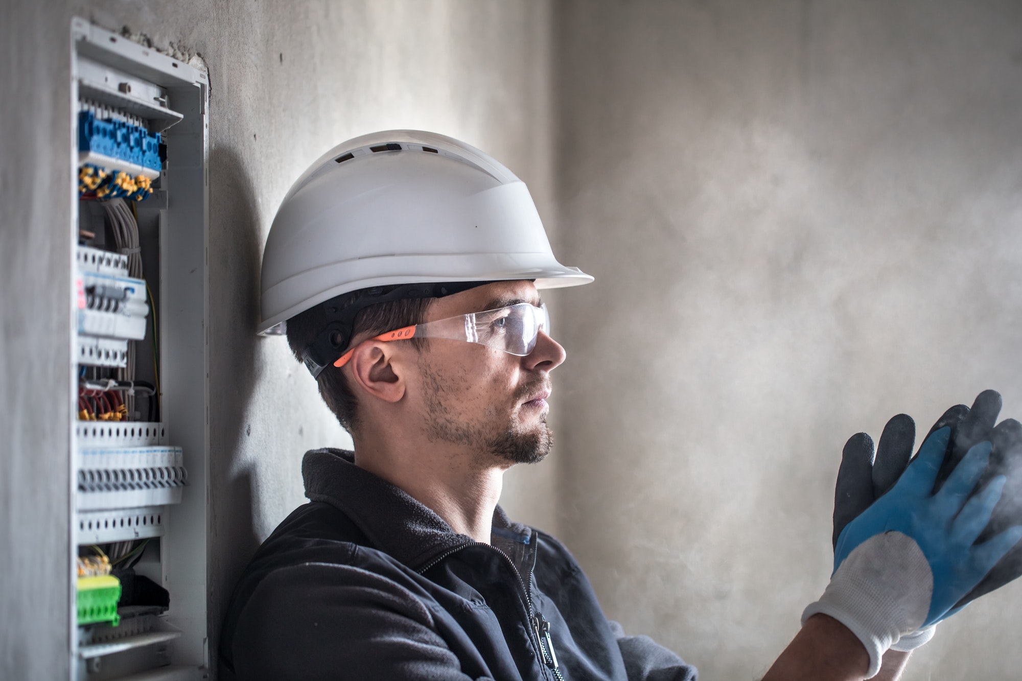 Man, an electrical technician.